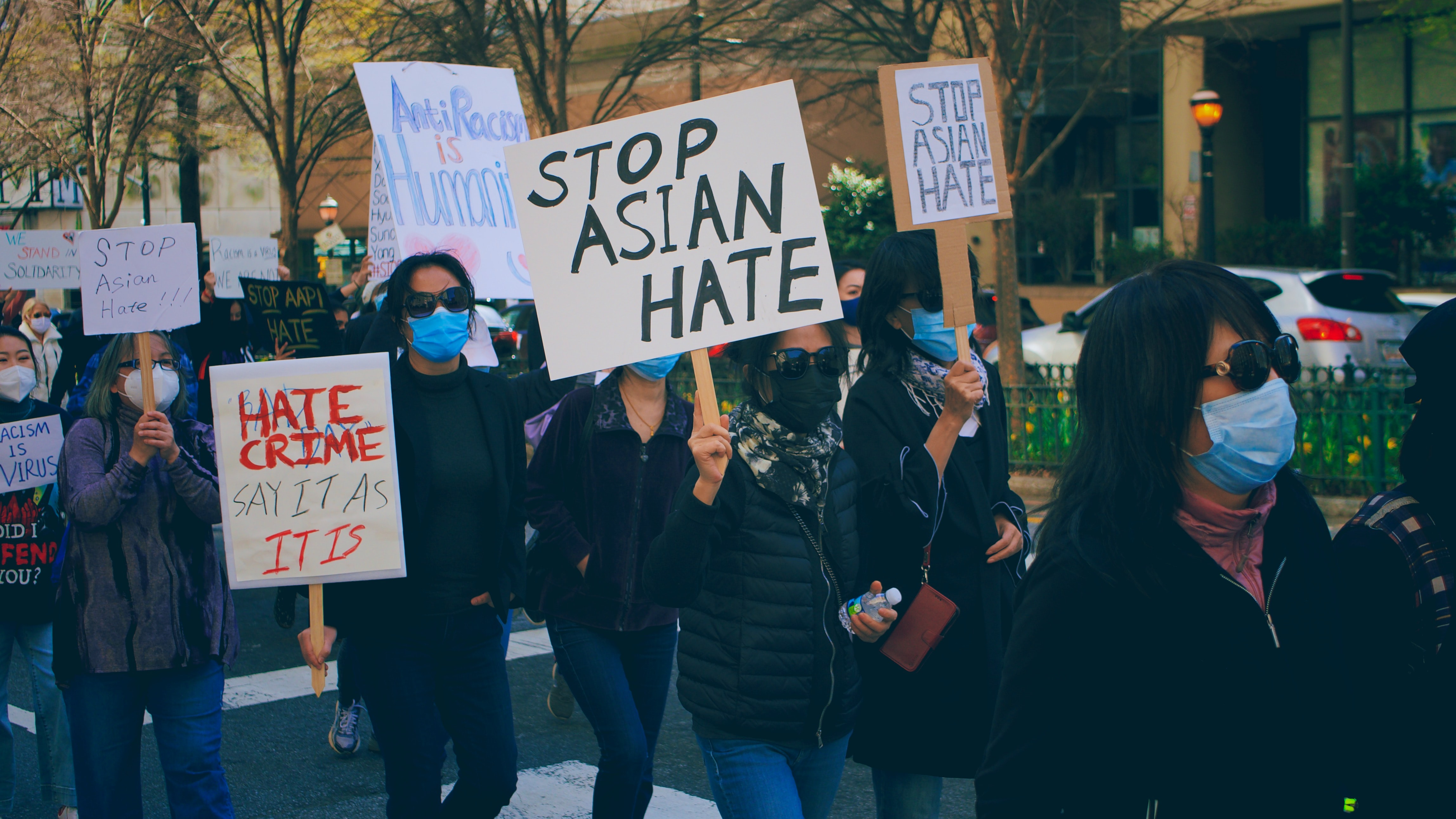 Stop Asian Hate protestors with signs